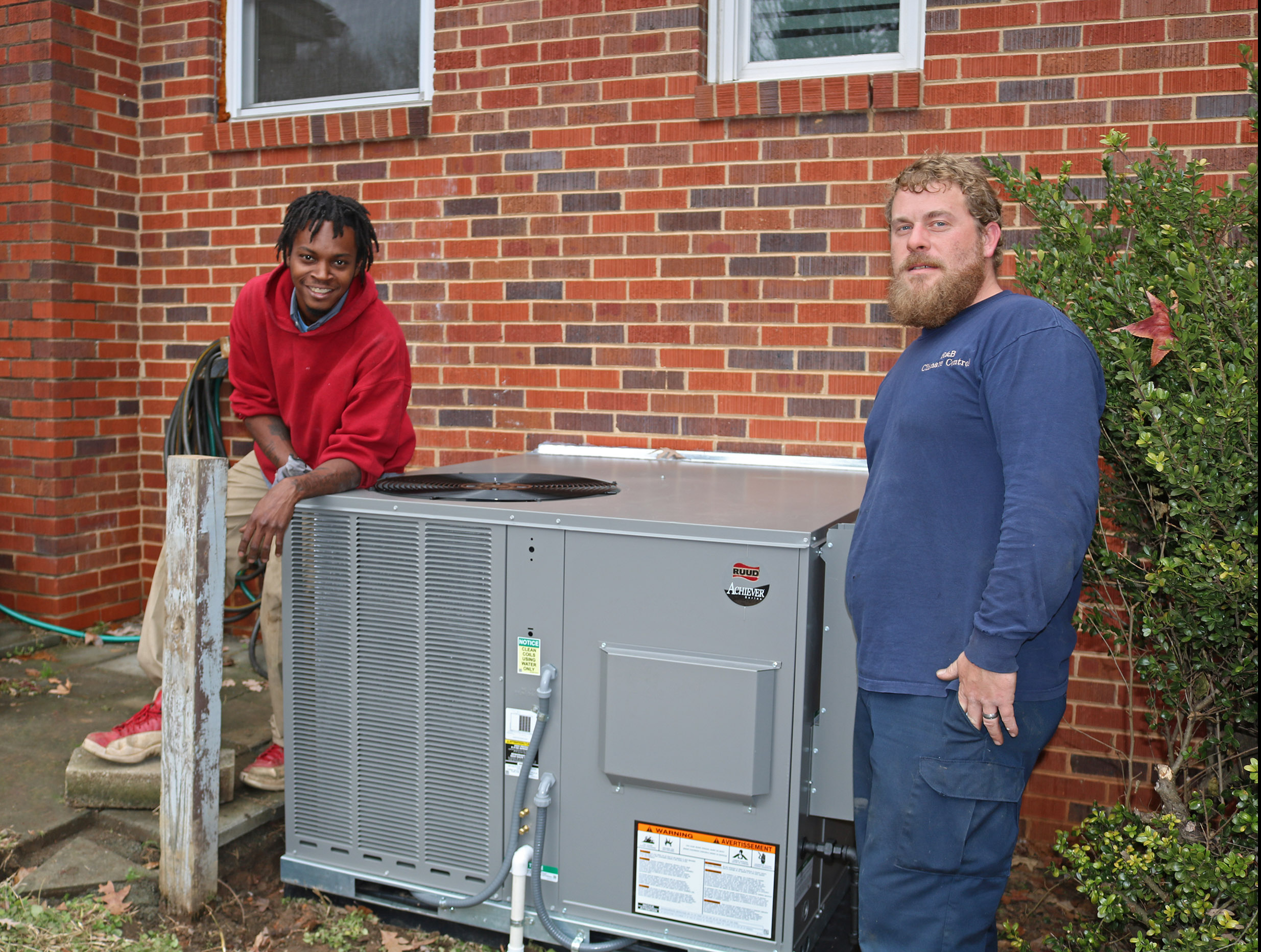 R & B Climate Control team & Staff working on a unit